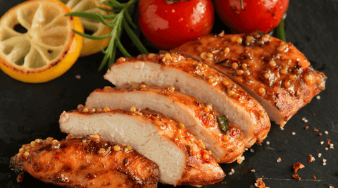 Homemade honey mustard chicken glazed with Happy Bees Market raw honey, served with herbs and a golden sauce.